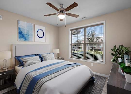 a bedroom with a large bed and a ceiling fan at The Dorset, Kansas City, Missouri