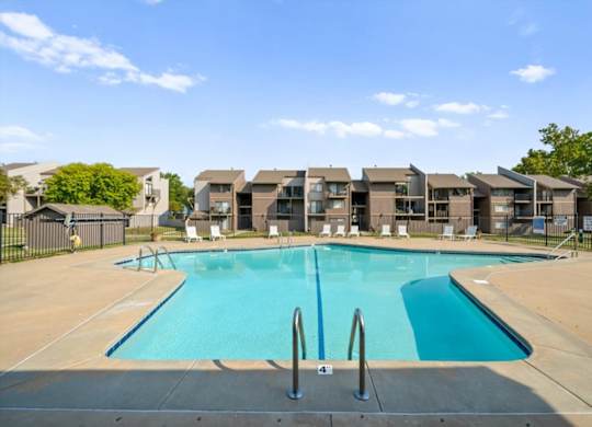 Swimming pool with Stainless steel railing at Bremerton Park Apartment Homes , Prairie Village