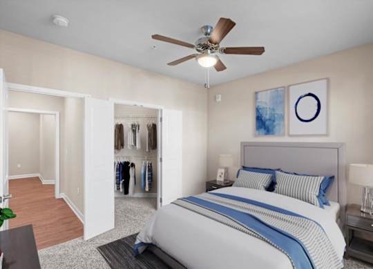a bedroom with a large bed and a ceiling fan at The Dorset, Kansas City, Missouri