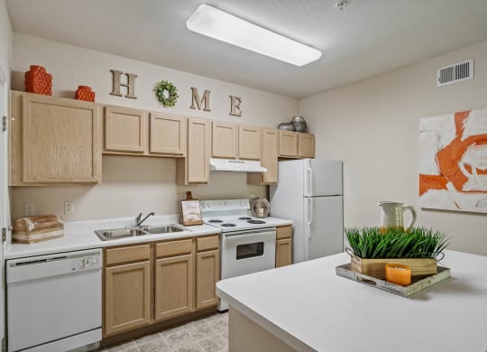 a kitchen with white appliances and wooden cabinets
