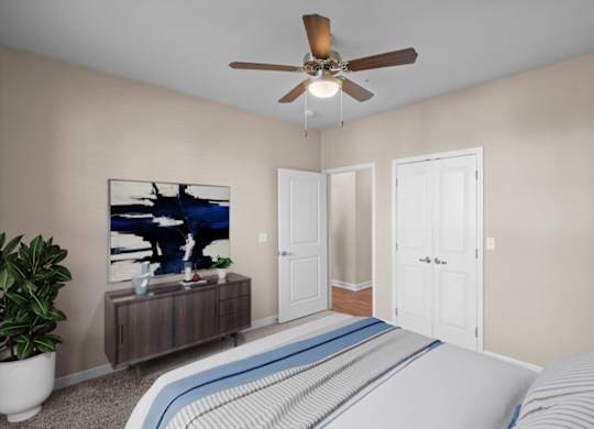 a bedroom with a bed and a ceiling fan at The Dorset, Kansas City, 64112