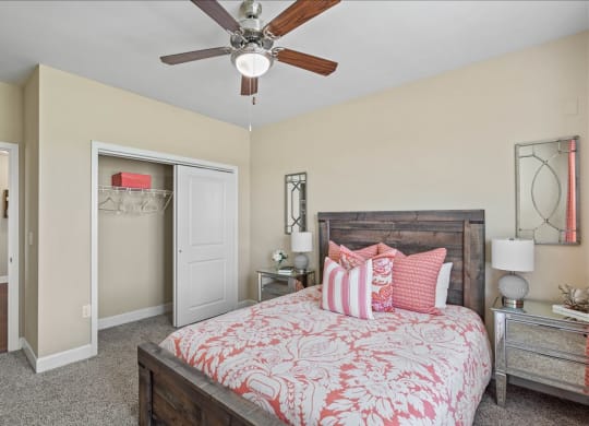 a bedroom with a bed and a ceiling fan at The Residences at Bluhawk Apartment Homes, Overland Park, 66085