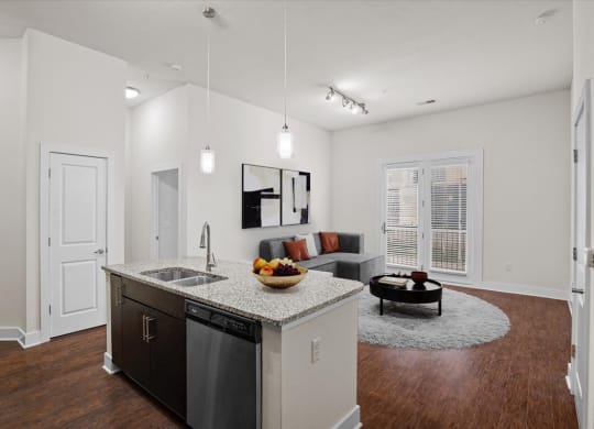 a kitchen and living room with a counter top
