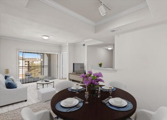 A living and dining room with a large sliding glass door patio.