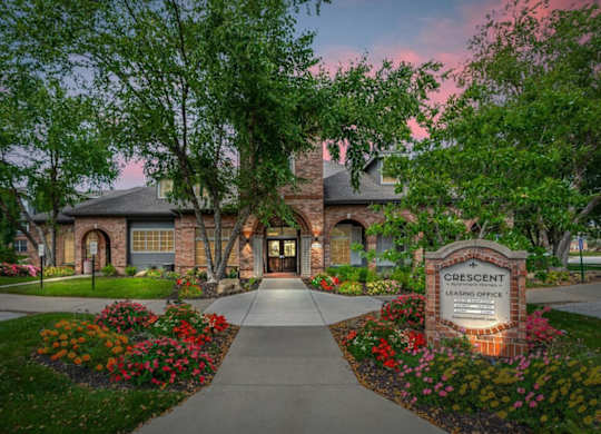 The Crescent Leasing Office is surrounded by a beautiful garden.