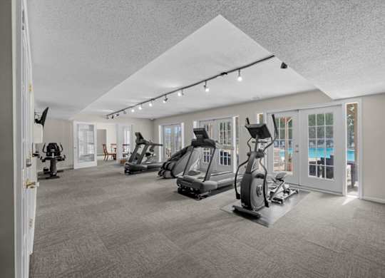 A spacious gym with a variety of exercise equipment.
