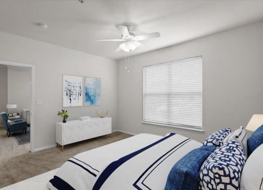 a bedroom with a large bed and a ceiling fan at Stonepost Lakeside, Olathe, KS, 66062