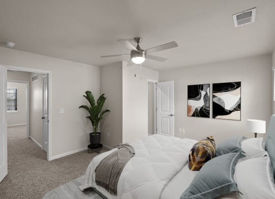 a bedroom with a large bed and a ceiling fan