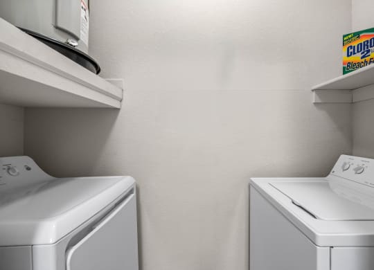 a laundry room with a washer and dryer