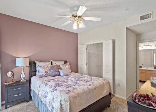 a bedroom with a bed and a ceiling fan  at Claremont, Kansas