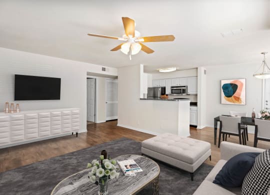 a living room with white walls and a ceiling fanat Stonebriar Woods Apartments, Kansas, 66213