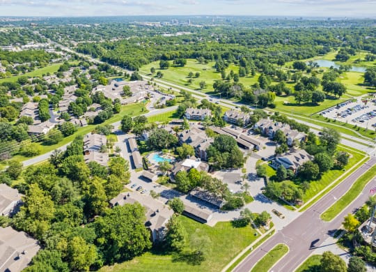 an aerial view of a neighborhood with houses and treesat Stonebriar Apartments, Kansas
