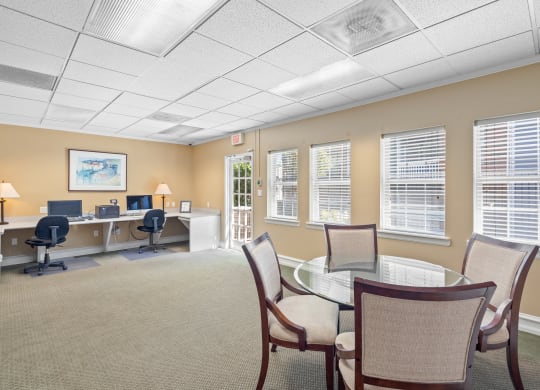a room with a table and chairs at Stonebriar Apartments, Overland Park