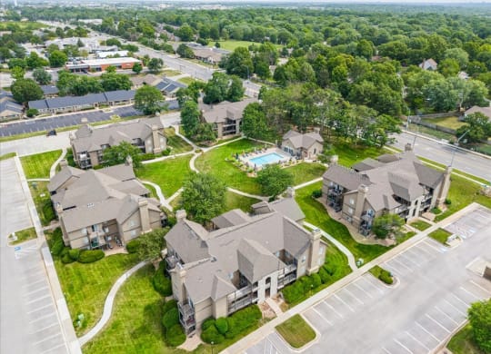 an aerial view of houses in a neighborhood with a swimming pool at Deerfield Apartments, Olathe, KS, 66062