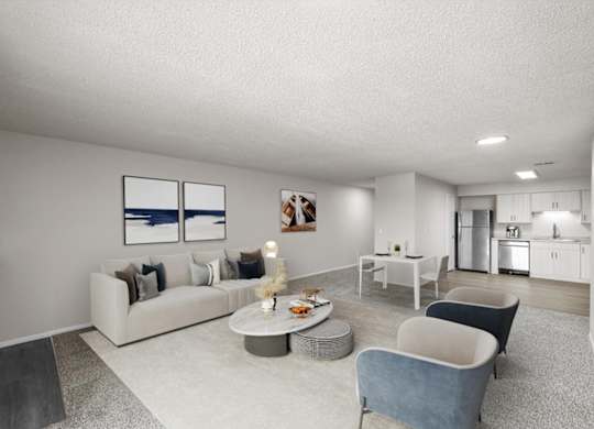 A modern living room with a grey sofa, a grey armchair, a grey coffee table, and a grey rug.