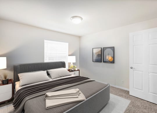 a bedroom with a bed and two nightstandsat Stonebriar Woods Apartments, Kansas, 66213