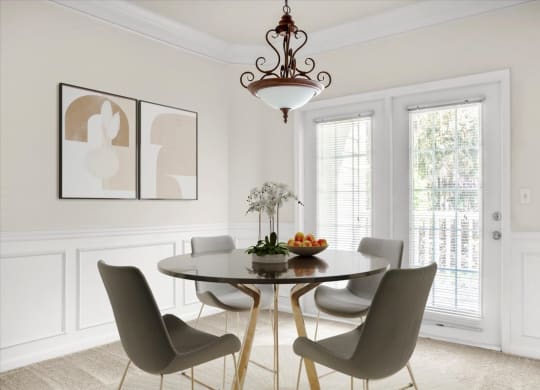 a dining room with a table and chairs