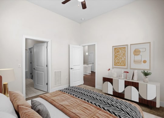 a bedroom with a bed and a door to a bathroom