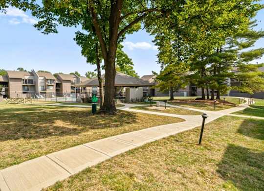 Walkway in the grassy area at Bremerton Park Apartment Homes , Kansas