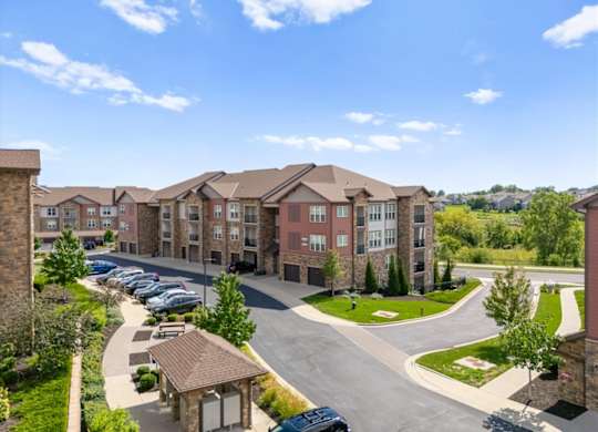 Large apartment complex exterior at The Residences at Bluhawk Apartments, Overland Park, KS
