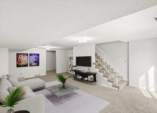 a living room with a couch and a tv