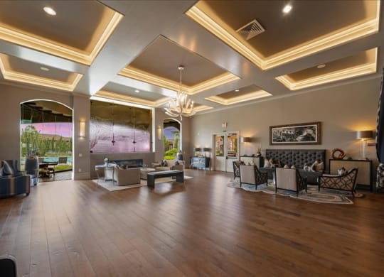 a large living room with furniture and a large window