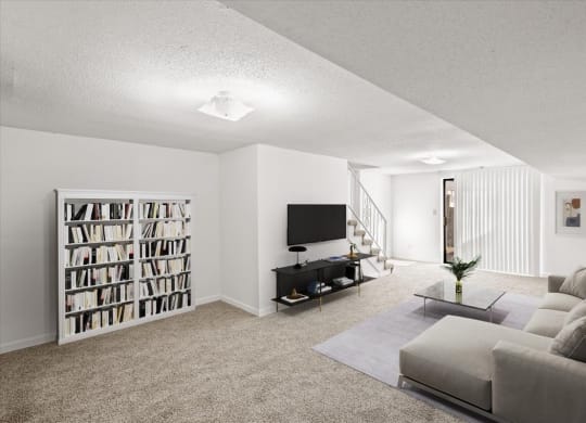 a living room with a couch and a tv