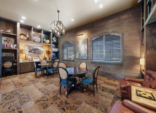 a dining room with a table and chairs