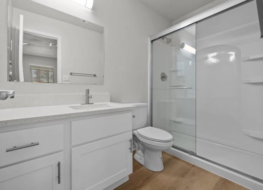 a bathroom with a sink toilet and a shower at Highland Park Apartment Homes, Kansas, 66214