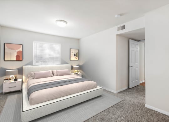a bedroom with a bed and two night standsat Stonebriar Woods Apartments, Overland Park, Kansas