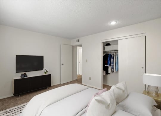 A secondary bedroom with a sliding door closet.