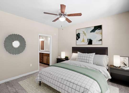 a bedroom with a bed and a ceiling fan at The Dorset, Kansas City, Missouri