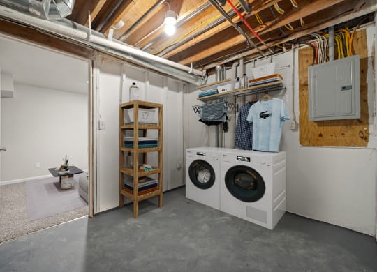 a laundry room with a washing machine and a dryer