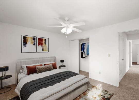 a bedroom with a bed and a ceiling fan at Deerfield Apartments, Olathe, KS, 66062