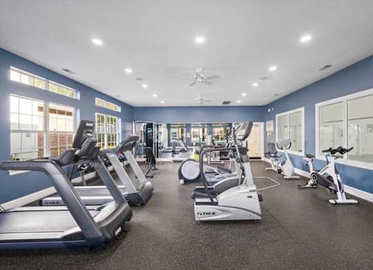 A spacious gym at The Claremont Apartment Homes, Overland Park, KS 66210