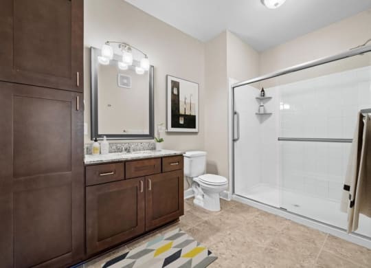 a bathroom with a toilet and a shower