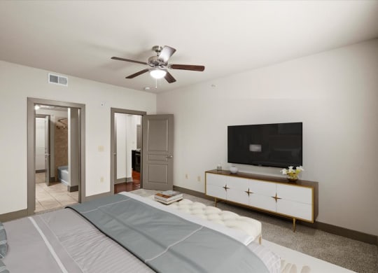 a bedroom with a large bed and a ceiling fan