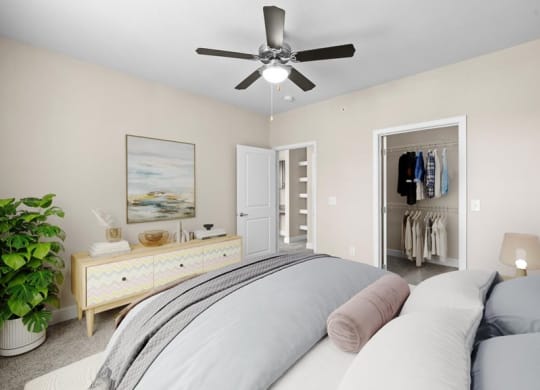 a bedroom with a bed and a ceiling fan