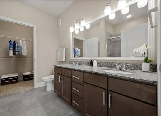 Bathroom with mirror at The Residences at Bluhawk Apartments, Overland Park,