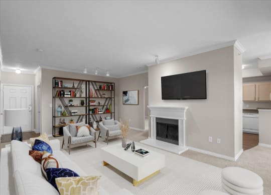 a living room with a fireplace and a bookshelf at The Clairborne Apartment Homes, Texas