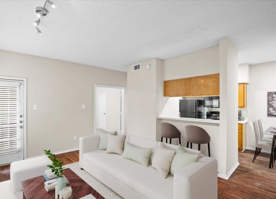 a living room with a couch and a coffee table at Creekview Apartment Homes, Dallas, Texas