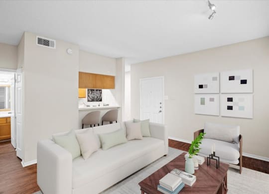 a living room with a couch and a coffee table at Creekview Apartment Homes, Texas, 75254