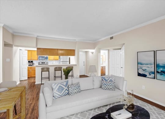 a living room with a couch and a table at Creekview Apartment Homes, Dallas, 75254
