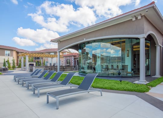 Poolside Relaxing Chairs at Sorrento at Deer Creek Apartment Homes, Overland Park, Kansas