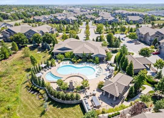 an aerial view of a house with a pool in the yard at Stonepost Crossing Apartments, Overland Park, KS, 66213