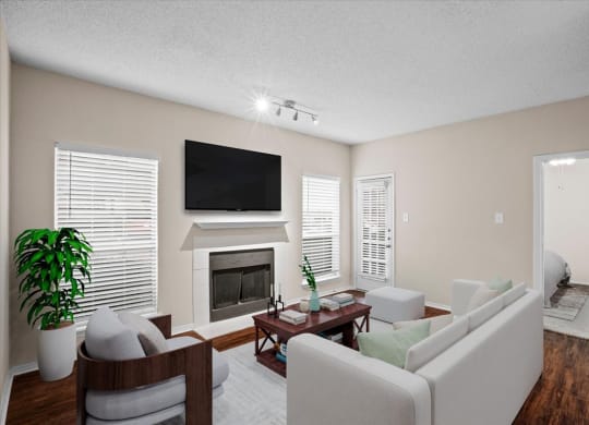 a living room with a fireplace and a tv at Creekview Apartment Homes, Dallas, 75254