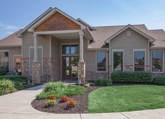 The exterior of the valley side cabana clubhouse with pretty landscaping.