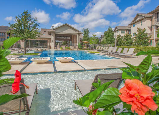 pool with flowers at Ovation at Lewisville Apartments, Lewisville, Texas