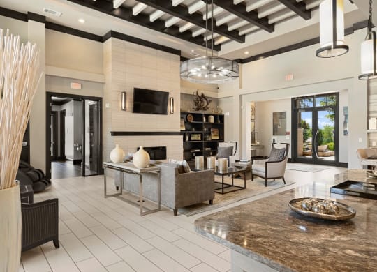 a large living room with a fireplace and a table