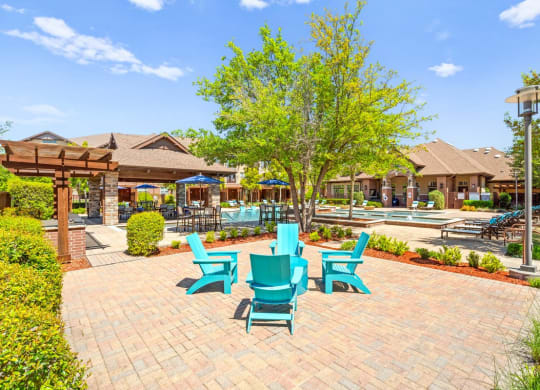 the preserve at ballantyne commons courtyard with blue chairs and trees